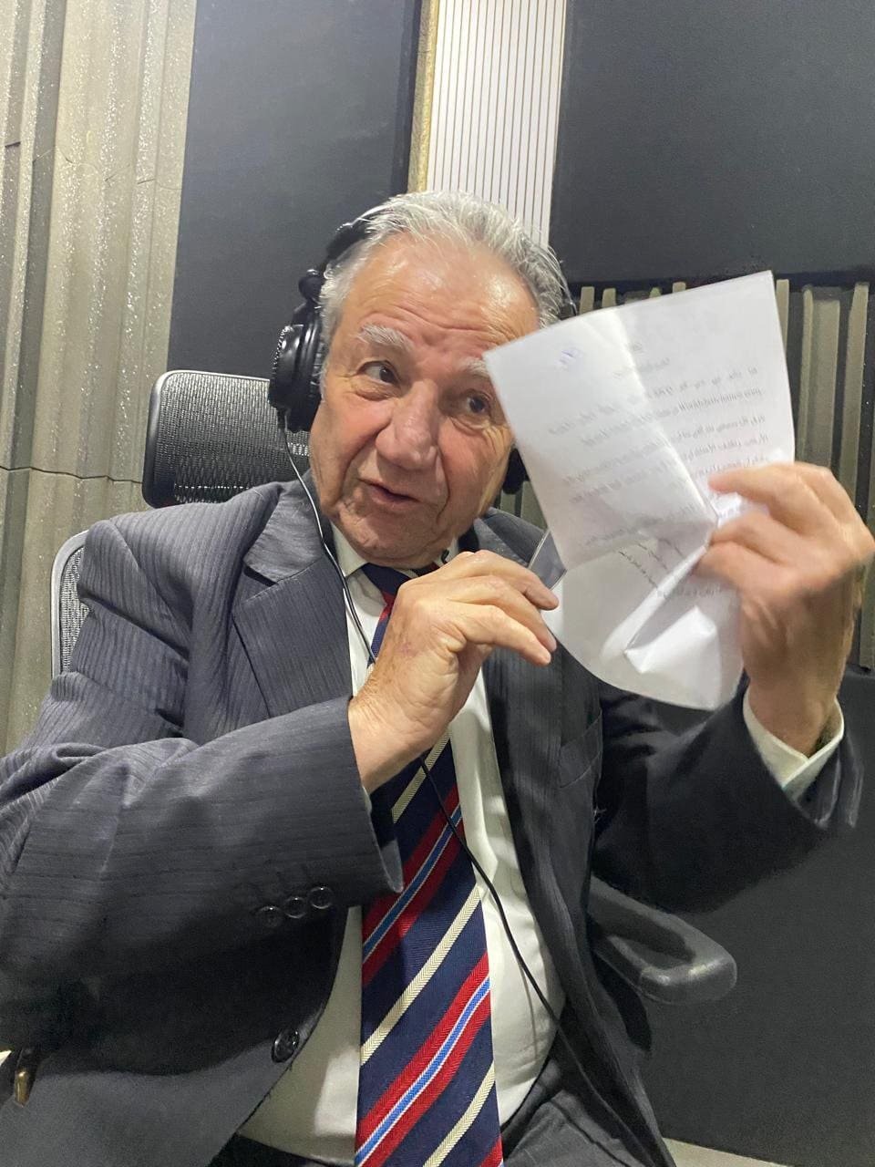 Jihad Al-Atrash working from a script in the booth