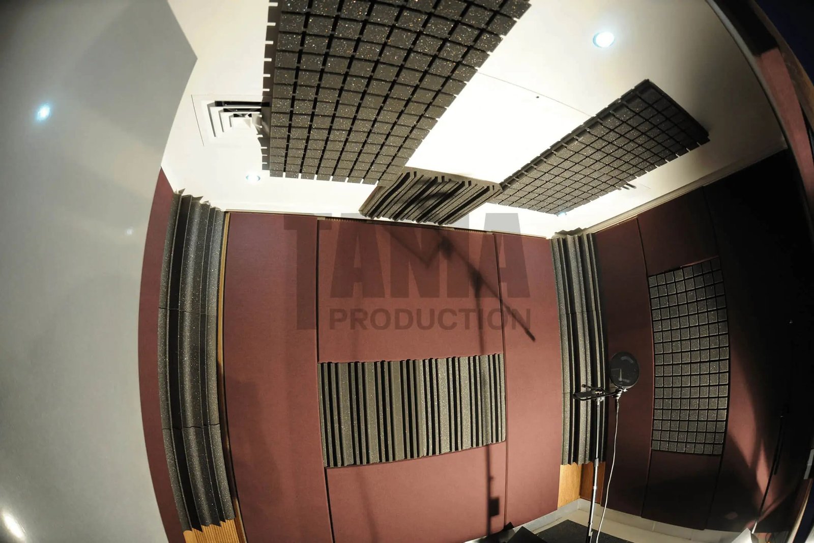 A recording booth lined with acoustic panels